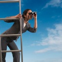 Woman on a ladder searching