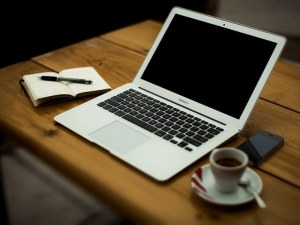 Laptop and coffee cup