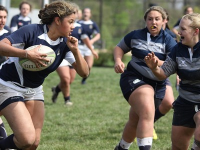 women playing rugby, women's sport week featured