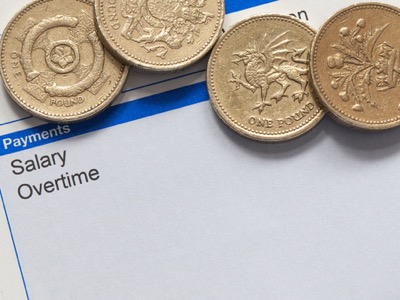 wage slip with pound coins featured