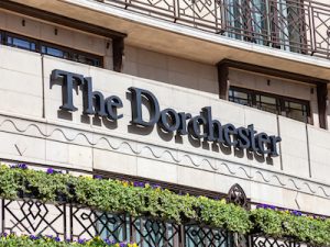 The Dorchester Hotel advertising logo sign outside its hotel in Park Lane Mayfair Hyde Park which is a popular travel destination tourist landmark of the city centre