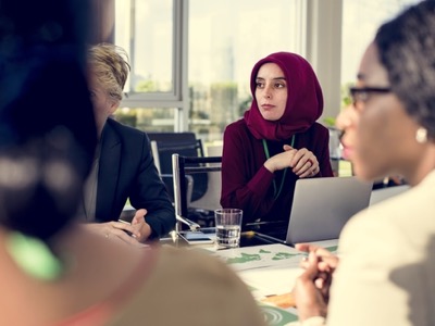 muslim lady wearing a headscarf at board meeting featured