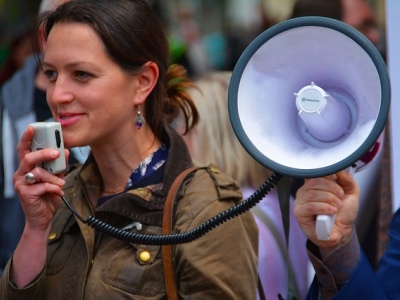 woman with a megaphone featured