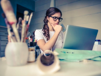 woman looking at laptop thinking, applying for jobs featured