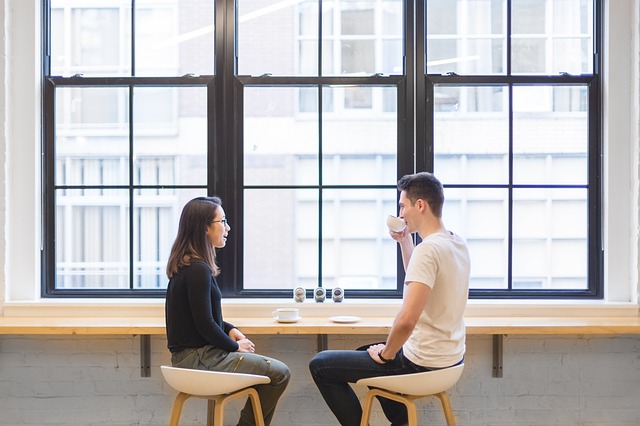 man and woman talking, coffee, communication