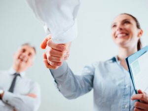 woman shaking hands, job interview, strengths, personal impact