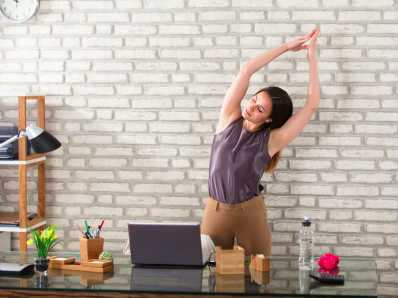 woman stretching in the office, office exercise, workout