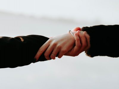 man and woman holding hands, mental health, wellbeing, mindfulness