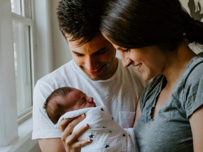 new parents looking at baby, paternity leave, maternity leave, mum, dad