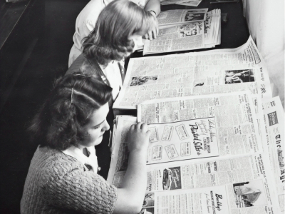 women reading newspapers, news