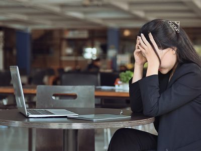 frustrated and stressed woman in office