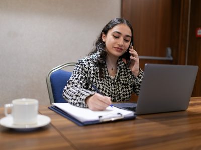 Young woman working at desk, career change