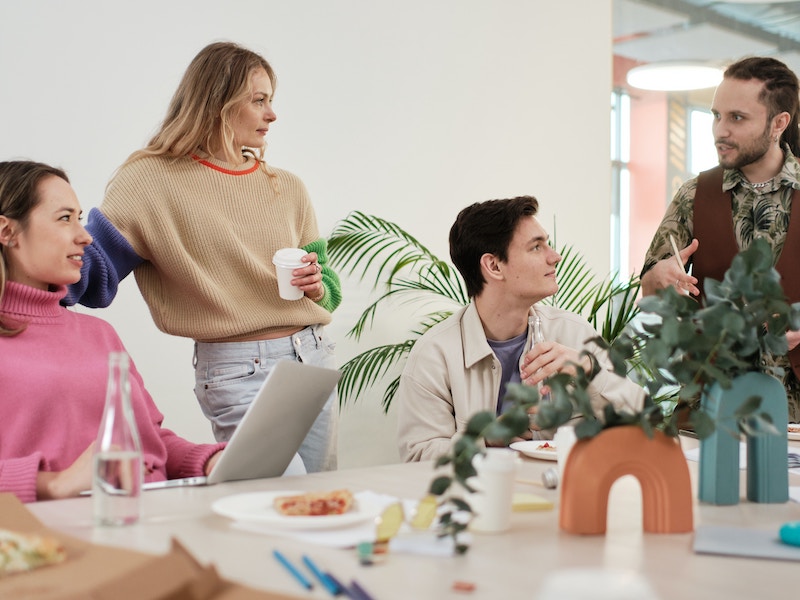 Group of employees working togetther in office