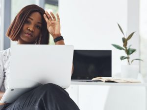 Woman working in office, resting during busy period