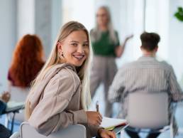 Happy woman studying for diploma