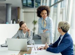 Group of female colleagues working together in office, female leadership