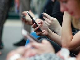 people scrolling through their phones