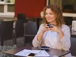 woman with red curly hair coffee.jpg