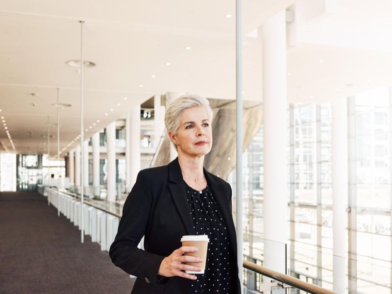 Portrait of woman holding coffee cup