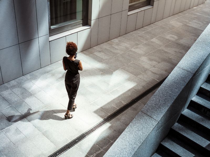 Woman walking down office building