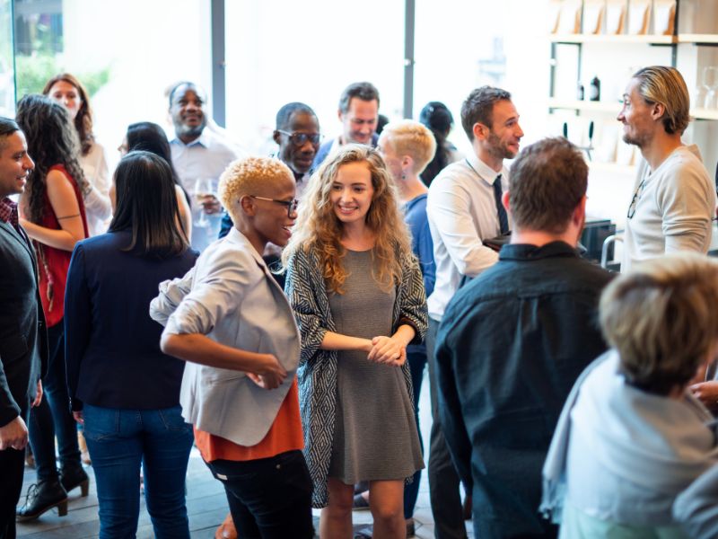 Diverse group socialising at a casual event men and women of various